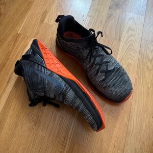 Nike Black and Gray Sneakers with Orange Accents